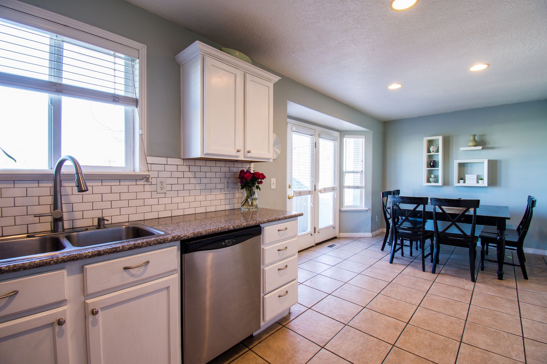 Spacious kitchen and dining area with natural light and modern decor in Bellevue, WA